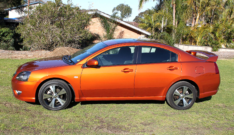 Orange Mitsubishi 380 side view