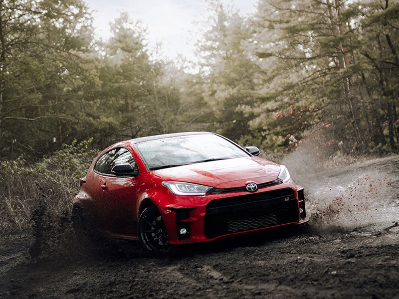 Toyota Yaris GR rally racing in mud